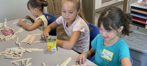 Crafts with popsicle sticks at Sisseton learning camp 2023